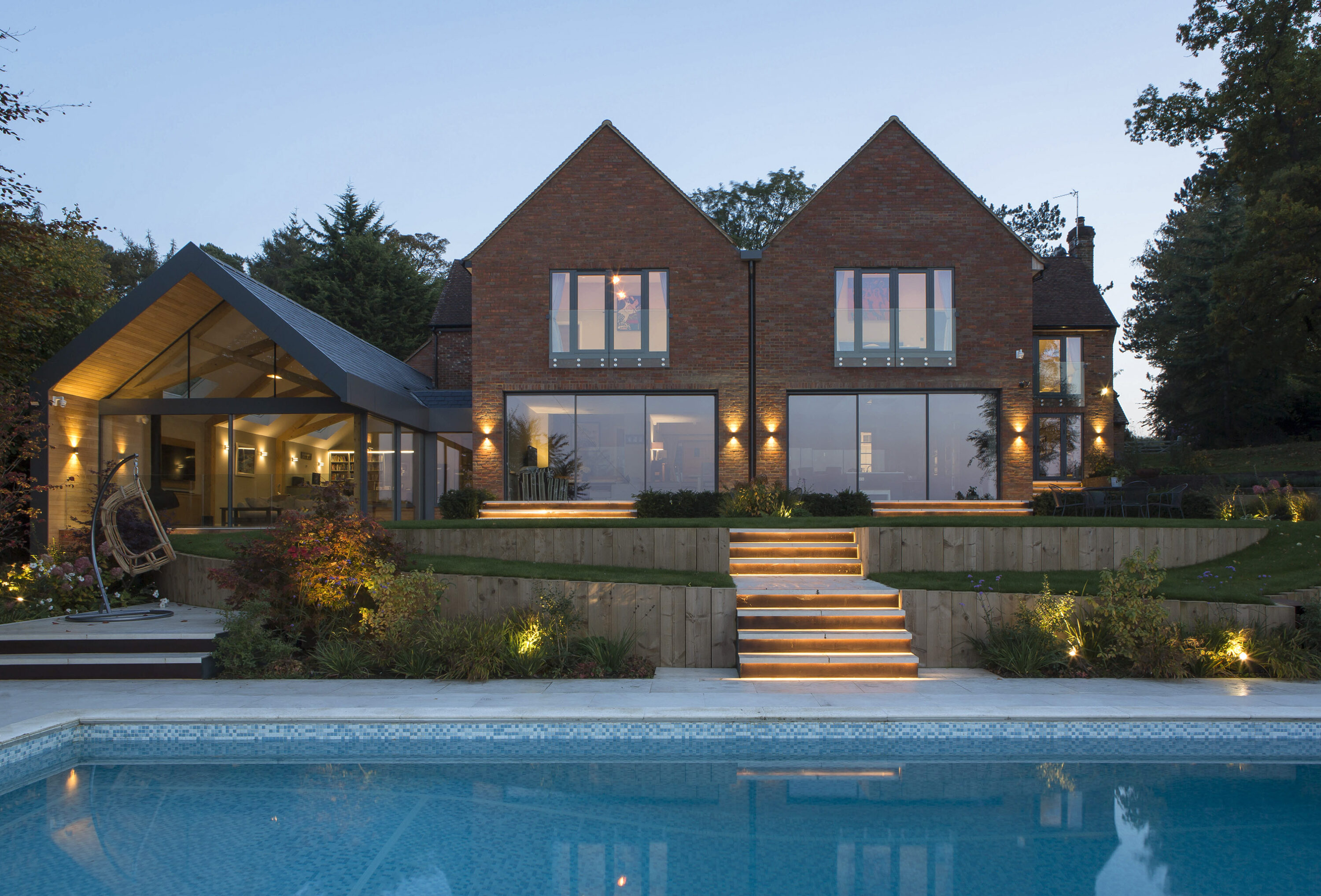 Beautiful landscaping tiered gardens with swimming pool and garden room