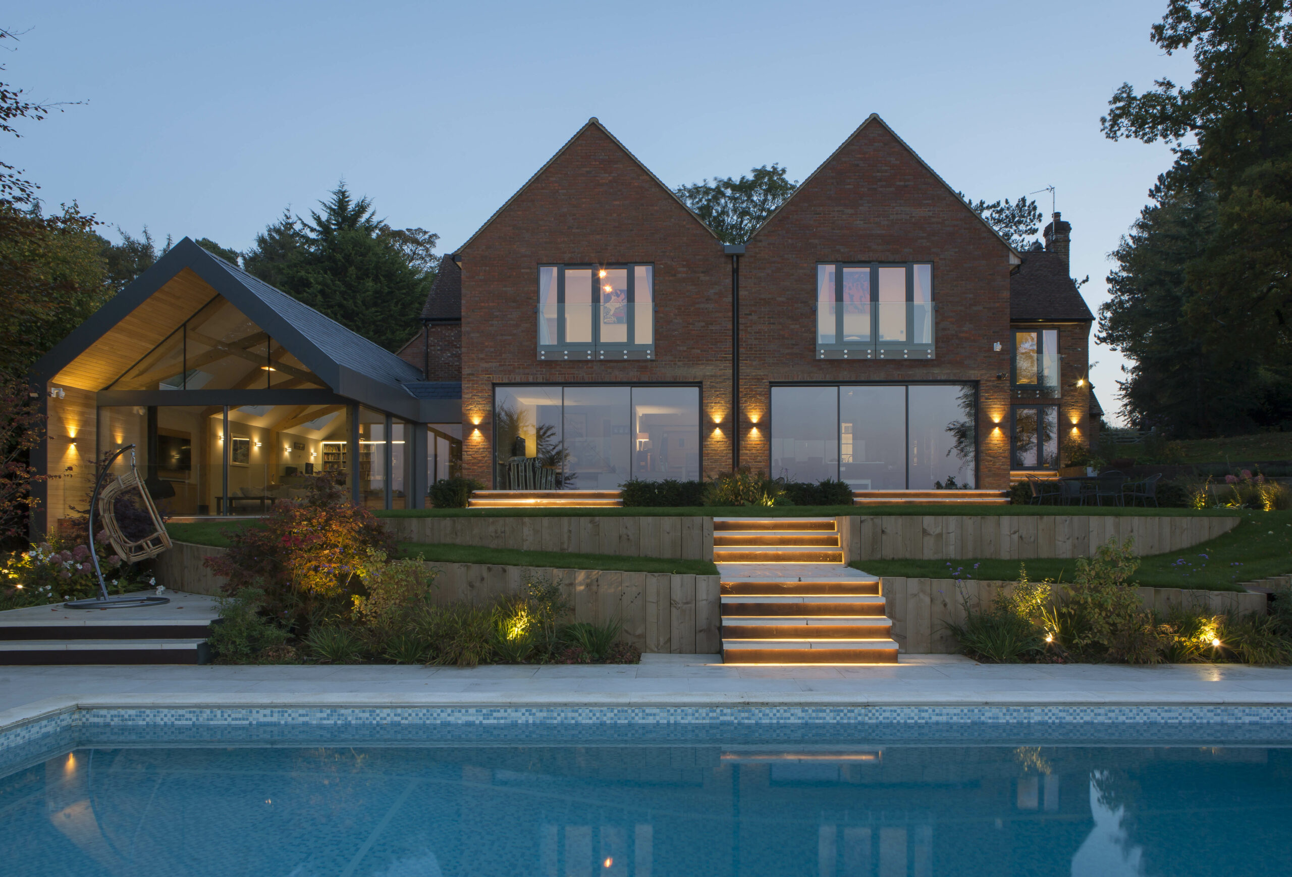 Beautiful landscaping tiered gardens with swimming pool and garden room