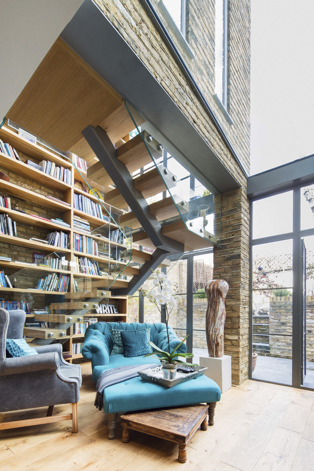 Double height steel glazed extension home library design