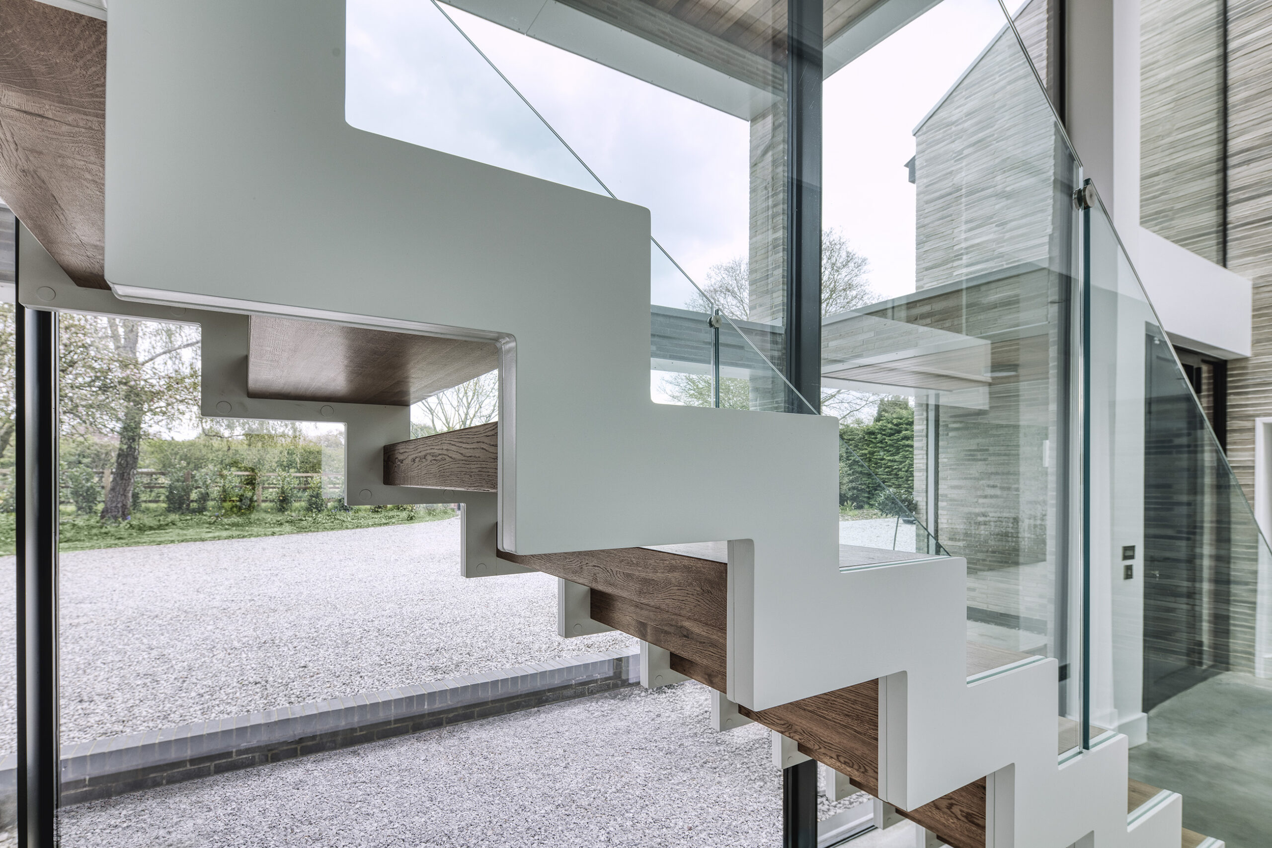 bespoke glass floating staircase interior design