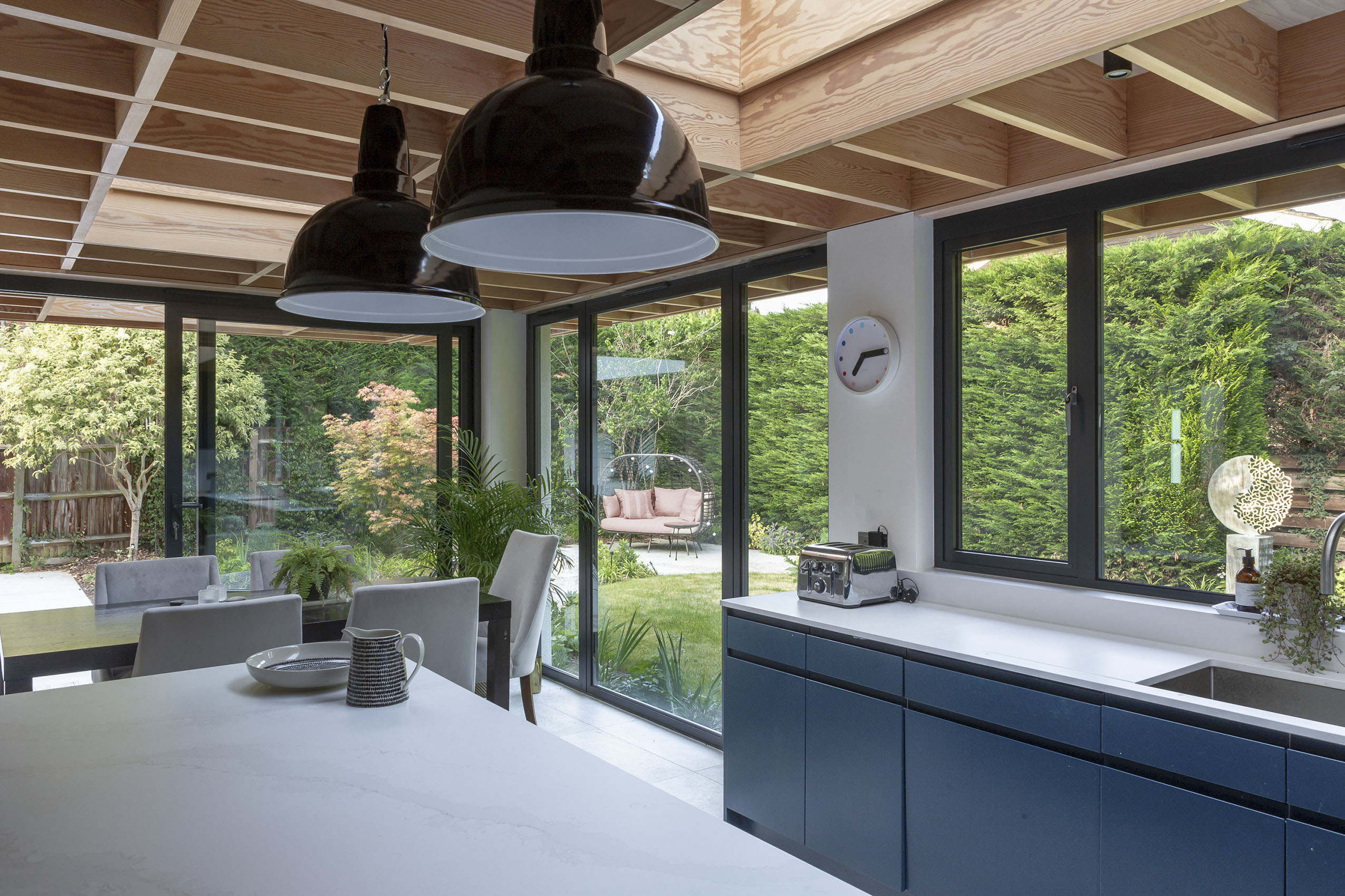 Modern living space renovation with indoor outdoor living garden design