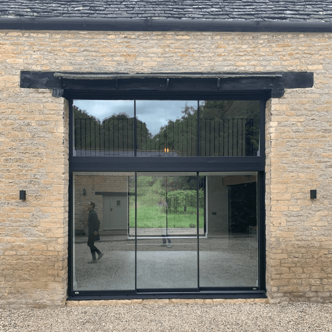 Barn conversion double height sliding door design