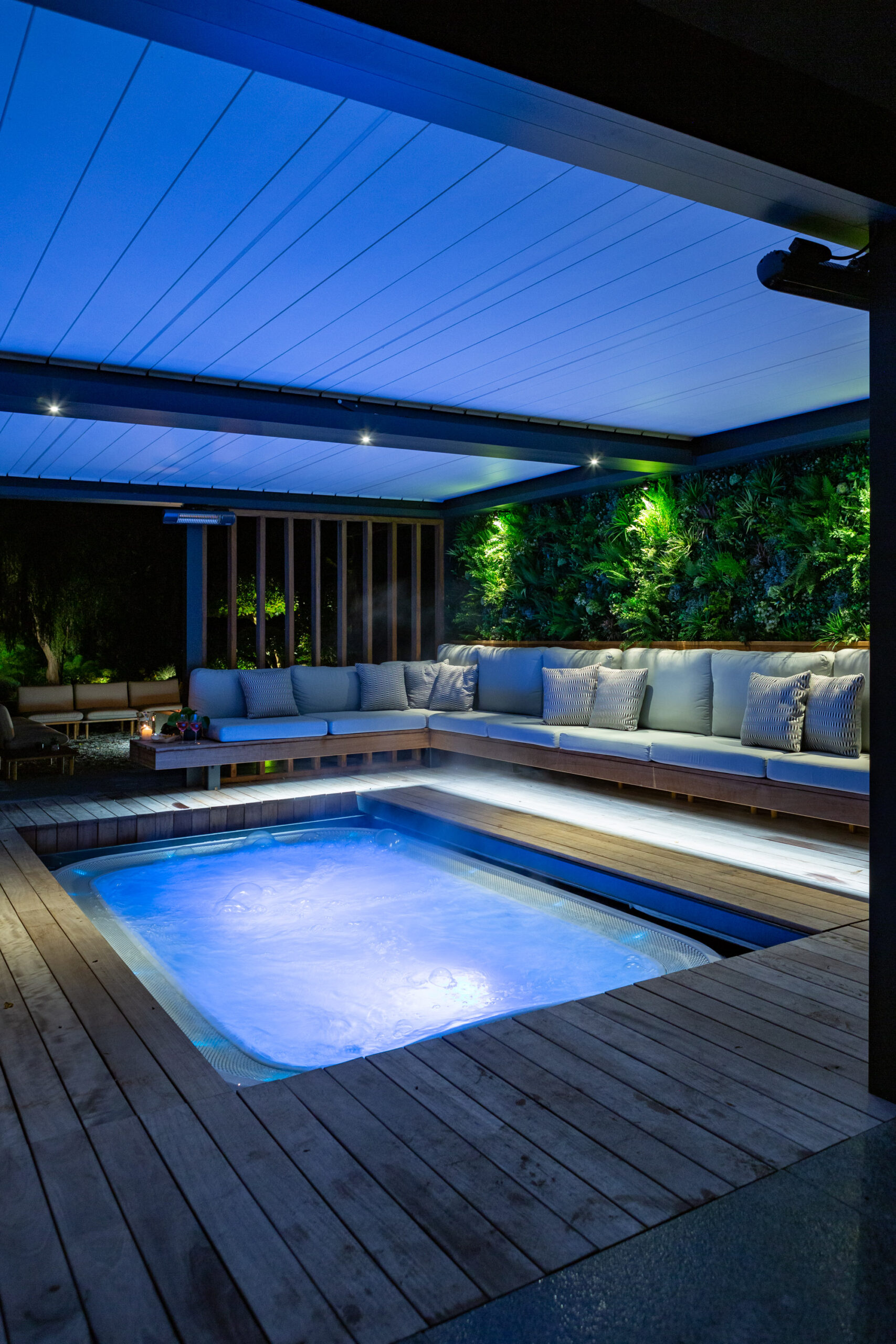 Luxury hot tub garden design beneath sliding deck