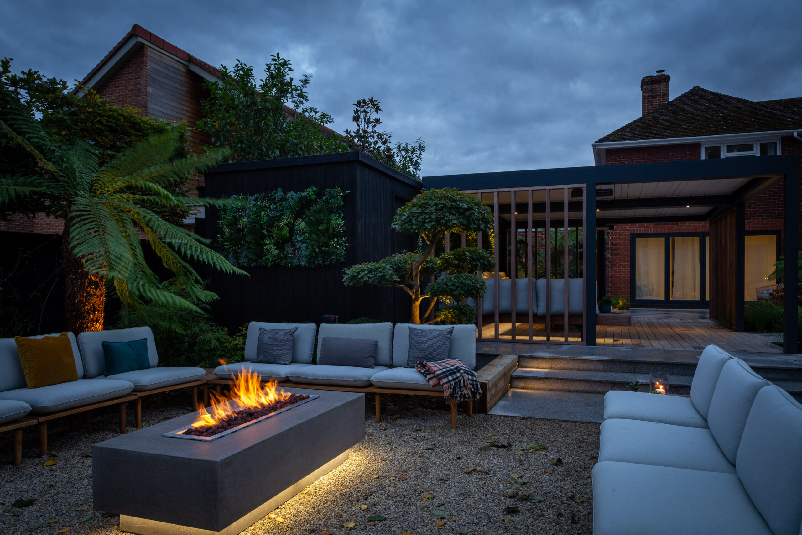 Lounge seating area with gas fire pit garden design