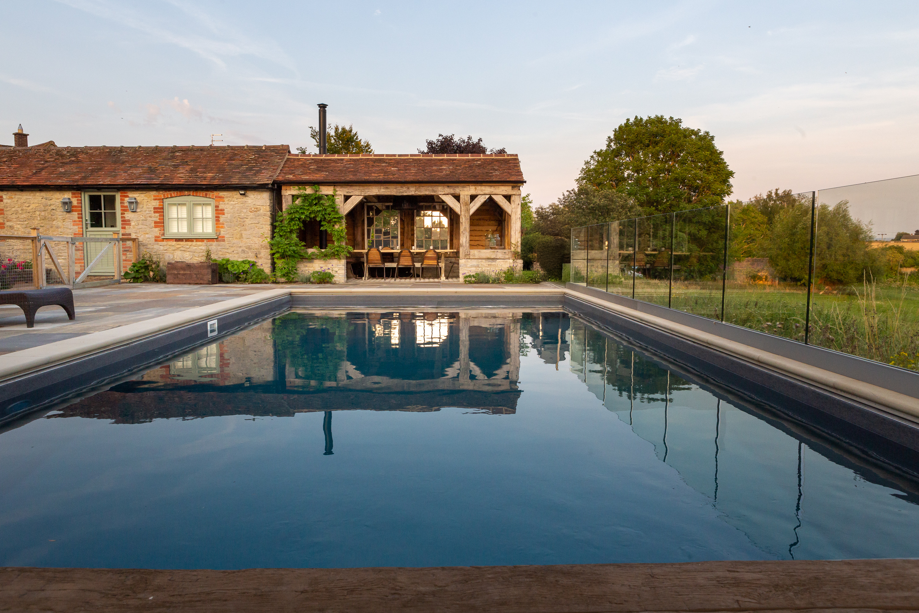 Sustainable restored oak poolside pavilion landscape design country home