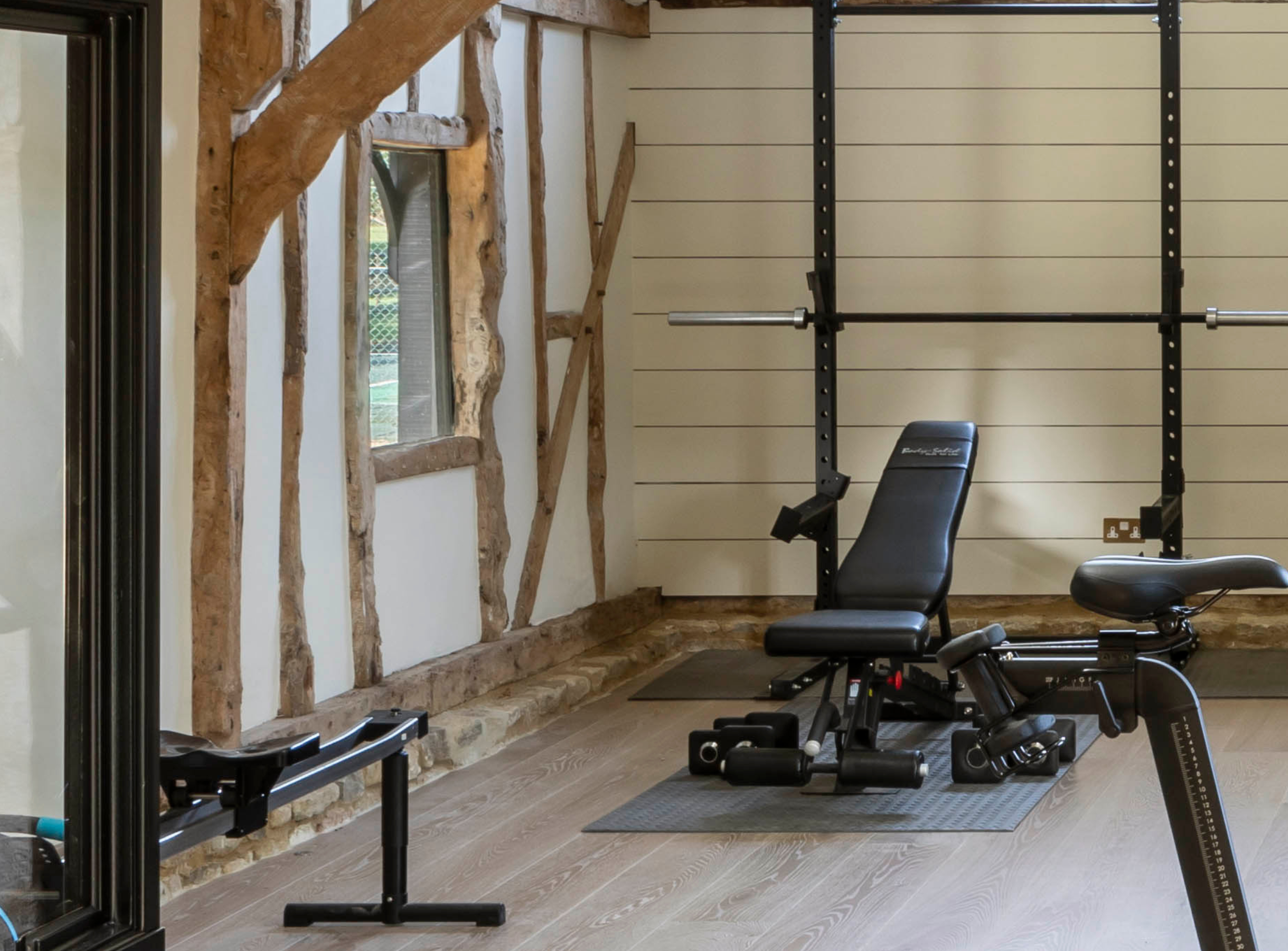 A stunning barn with a contemporary home gym