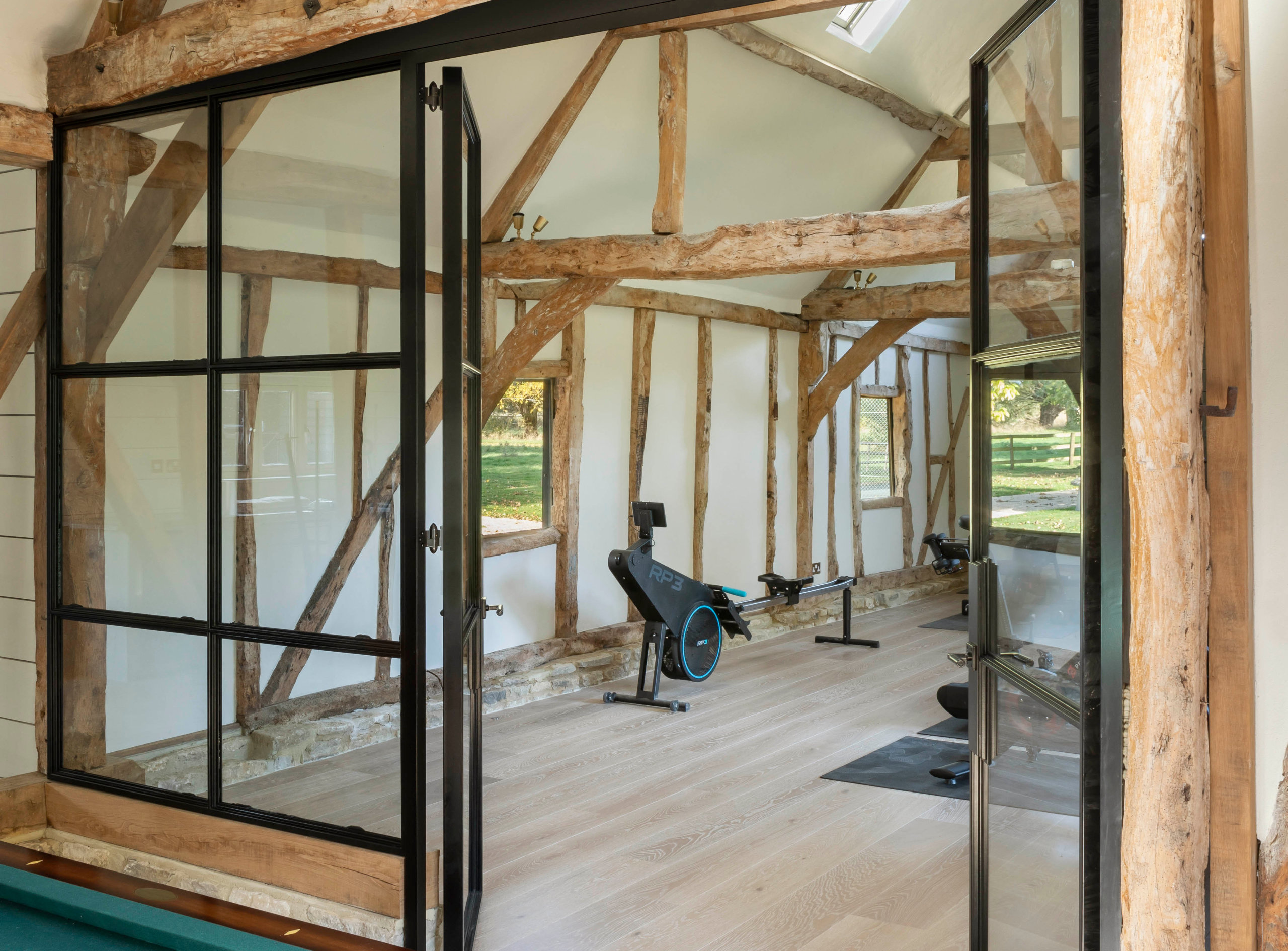 A beautiful modern home gym in a renovated barn
