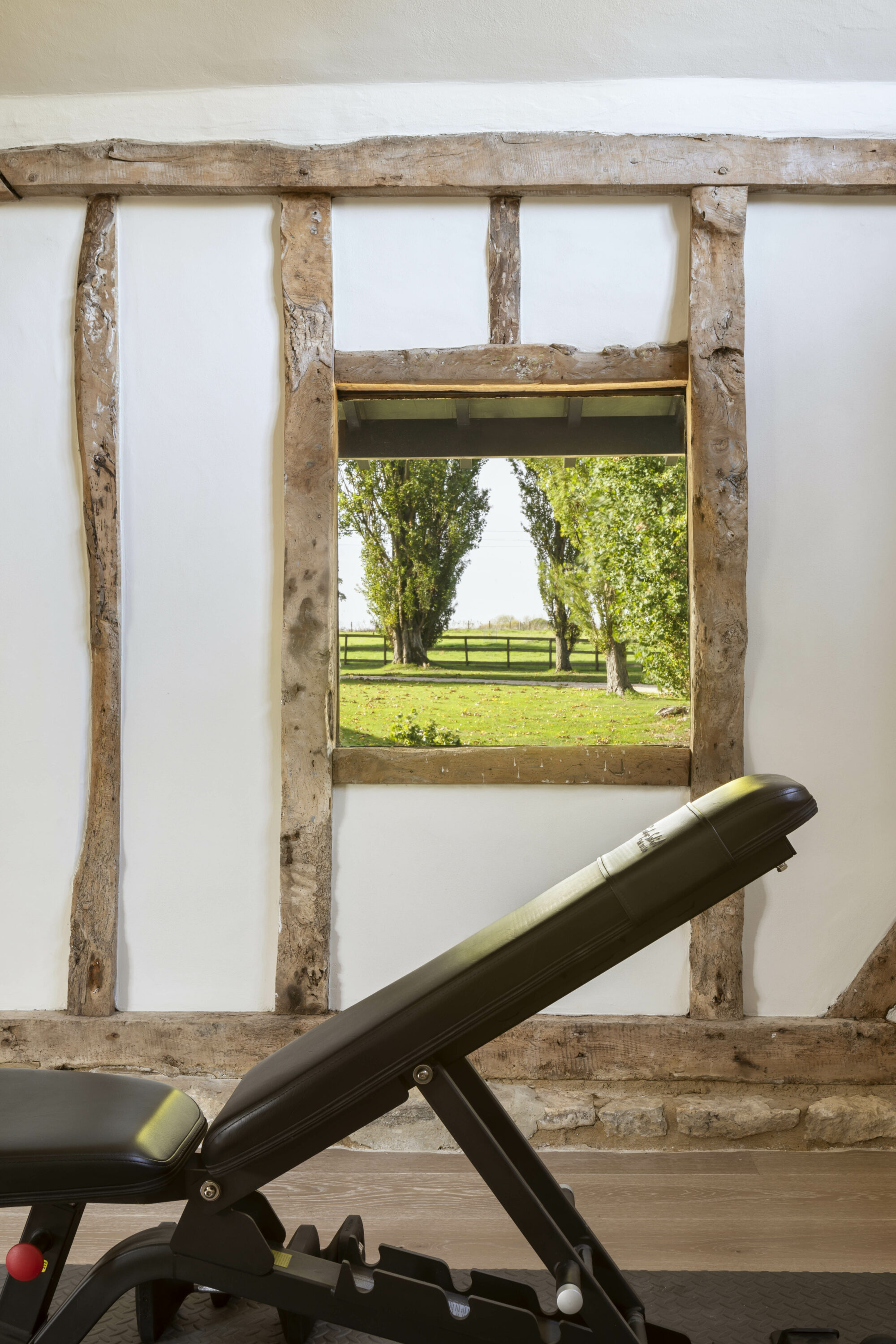 A Contemporary Home Gym in a Renovated Barn with a view