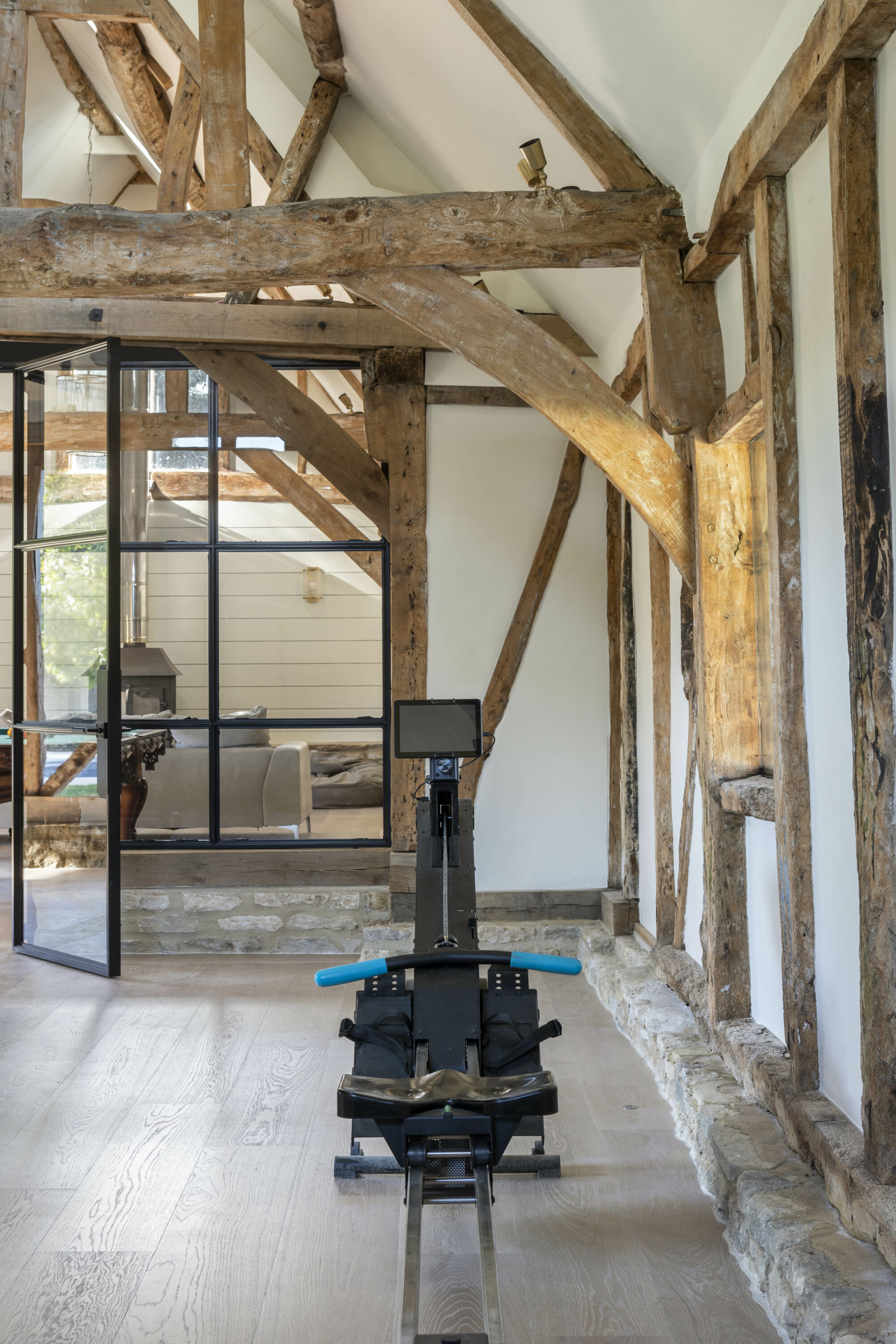 A Contemporary Home Gym in a Renovated Barn Portrait Image