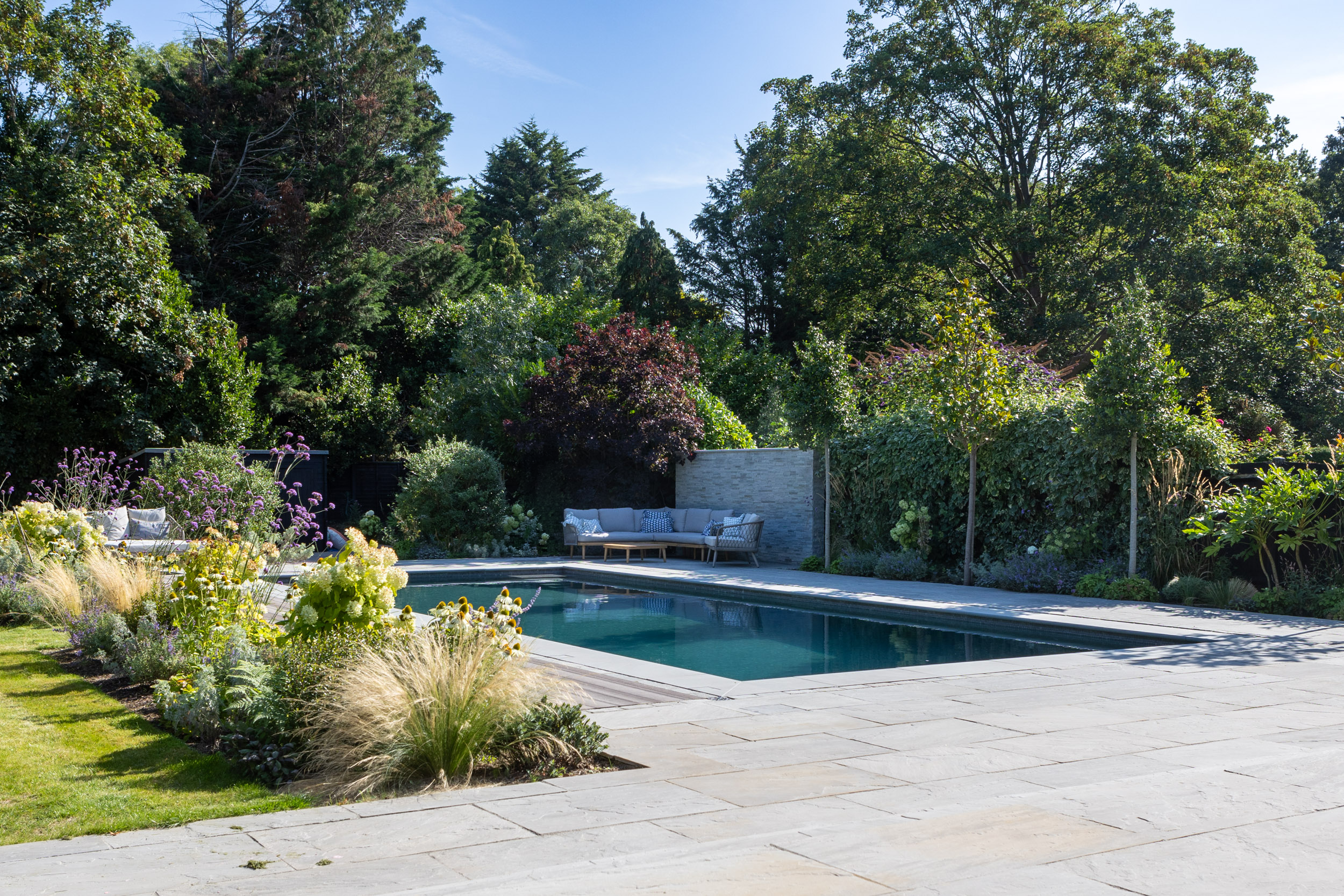 Beautiful timber sliding deck and cantilevered bench garden design